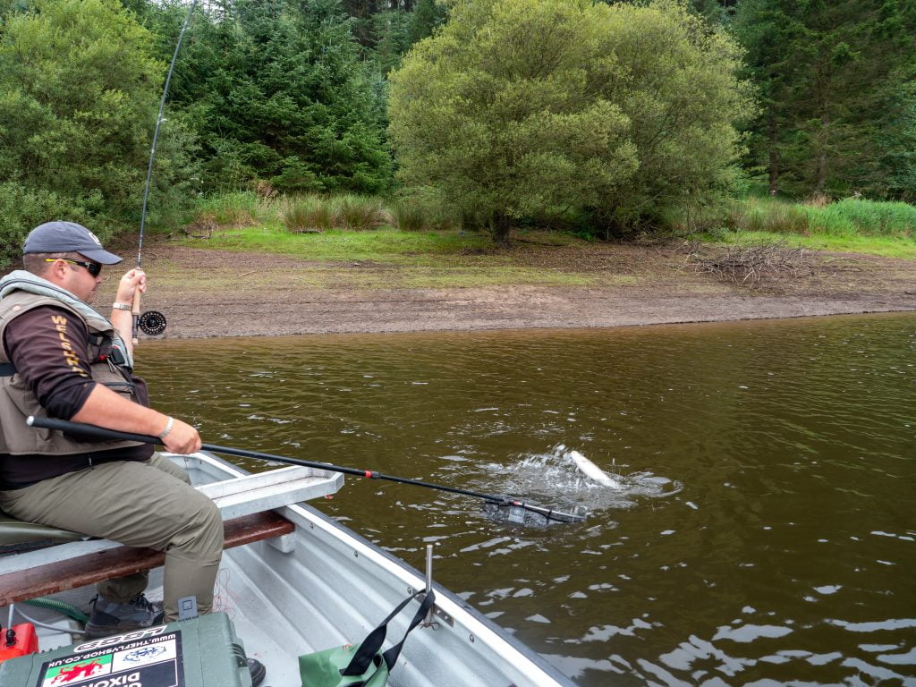 Gareth Dixon playing a Llyn Clywedog rainbow trout